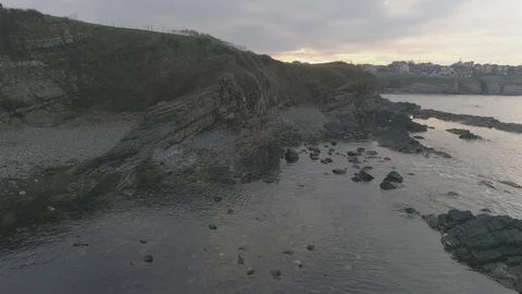 Drone top view Sunset the beach coast with rocks in foreground-not editing,4k Vídeos de archivo 100129111