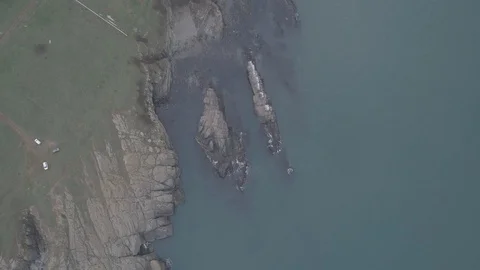 Drone top view Sunset the beach coast with rocks in foreground-not editing-4k Vídeos de archivo 100129180