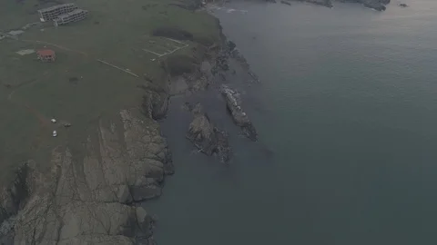 Drone top view Sunset the beach coast with rocks in foreground-not editing-4k 스톡 동영상 100129384