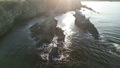 Drone top view Sunset the beach coast with rocks in foreground 스톡 동영상 230435703
