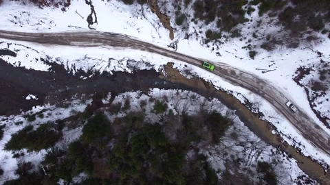 Drone top view SUV driving on a mountain road. winter. Stock Footage 168737675