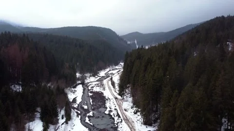 Drone top view SUV driving on a mountain road. winter. Video stock 168775313