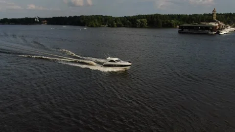 Drone top view tracking sailboat on dark water Video stock 333544643