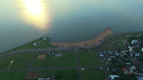 Drone tops down San josé beach at Encarnación paraguay, Sunset reflected on Stock-Footage 297154986
