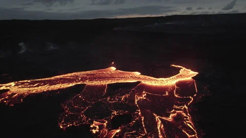 Drone Towards Flowing River Of Molten Lava Under Cloudy Sky Video stock 168771963