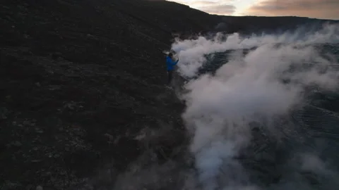 Drone Towards Man Texting Erupting Fagradalsfjall Volcano Stock Footage 160495628