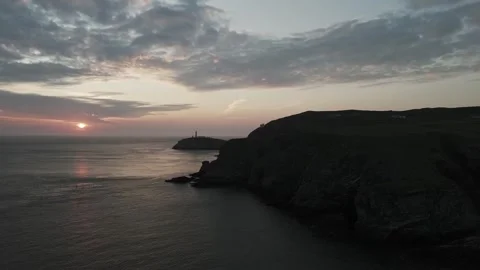 Drone tracking along coasline with sunset Stock Footage 277623317