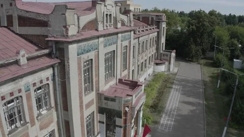 Drone tracking along facade of historic structure Video stock 333011487