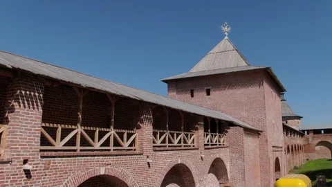 Drone tracking along fortress wall with tower Stock Footage 333959082