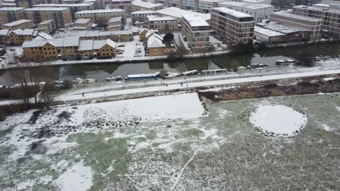 Drone tracking along snow path London Stock Footage 148264959