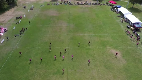 Drone tracking back with players of game of touch rugby Stock Footage 244778941