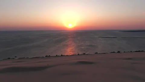 Drone tracking backward from Dune du Pilat with sunset distance, France Stock Footage 333107956