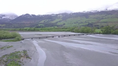 Drone Tracking Car Across Rees River Bridge Near Glenorchy, New Zealand 動画素材 248440022