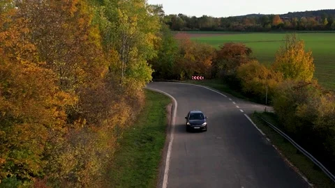 Drone tracking a car in the fall 库存影片 230023767