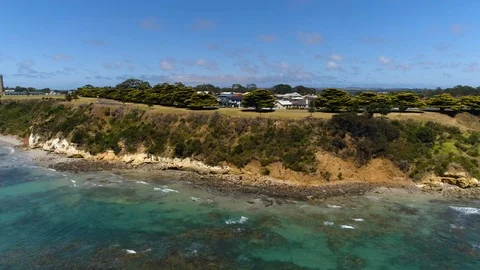 Drone tracking in on coastal town in Australia - UHD 30P. Stock Footage 87883659