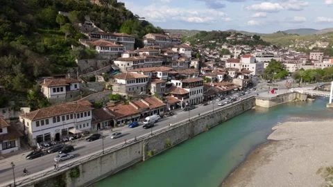 Drone Tracking Flight Along Turquoise River with Ottoman District Parallax Stock-Footage 335486583