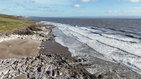 Drone Tracking Forward and Tilting Up Over Rocky Coast, Wales UK 4K Stock-Footage 334066963