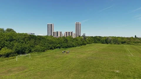 Drone Tracking Horse Carriages Moving Through Green London Park Toward City Stock Footage 309762000