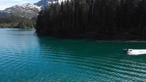Drone tracking jet ski with Alaskan mountains drone crash Stock Footage 96039438