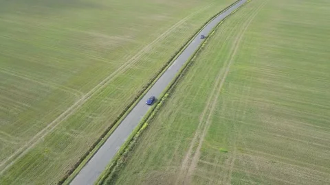 Drone tracking a moving car Stock Footage 147515093