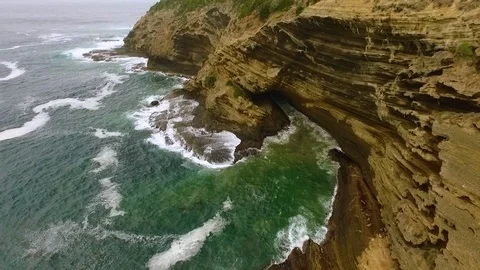 Drone tracking-out shot of the Cape Bridgewater cliffs. Stock Footage 87258748