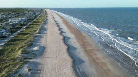 Drone tracking over sandy beach at sunset Amelia Island Florida 스톡 동영상 274398764