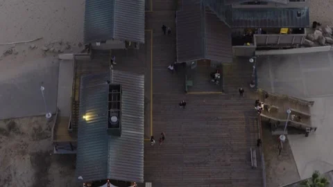 Drone Tracking Overhead Shot of Pier Then Sunset Stock Footage 339706488