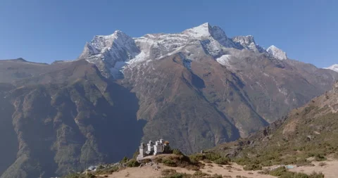 Drone tracking push in shot of mountain chortens near Namche Bazaar Nepal Stockbeeldmateriaal 337395332