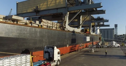 Drone tracking with ship loading aluminum ingots for export from Australia. Stock Footage 86852812