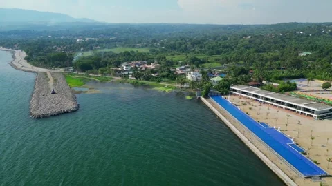 Drone Tracking Shot of Amusement Park Resort in front of Taal Lake view in Stock Footage 336037057