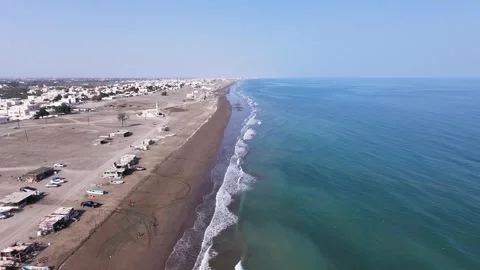 A drone tracking shot of the beach in Al-Suwaiq Wilayat Stock Footage 338240004
