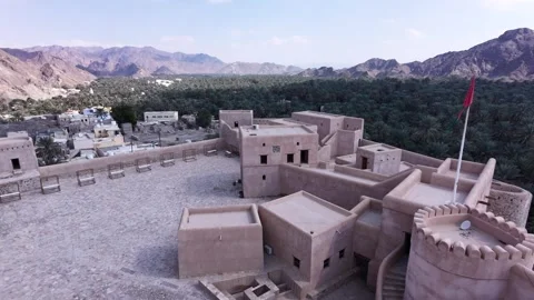 A drone tracking shot in the courtyard of Samail Fort Stock Footage 338238513