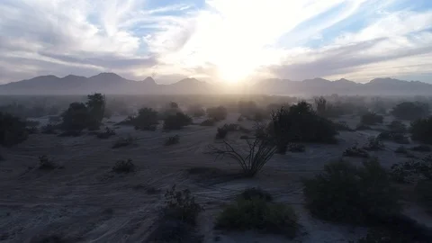 Drone Tracking shot dusk desert off road vehicle sunset baja 1000 Stock Footage 104883933