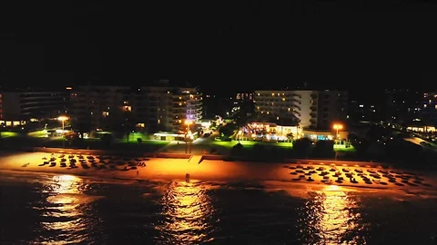 Drone tracking shot of empty beach resort at nighttime, in Mallorca, Spain. Stock Footage 125583610