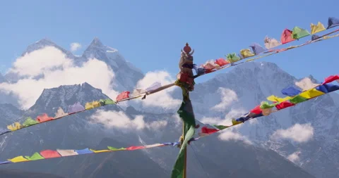 Drone tracking shot of Everest region Nepal showing colorful Buddhist prayer Stock Footage 339029997