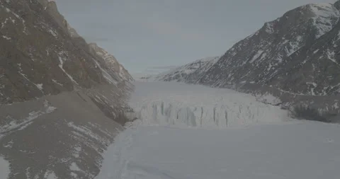 Drone Tracking Shot of Glacier Between Mountains, 4K Stock Footage 314513223