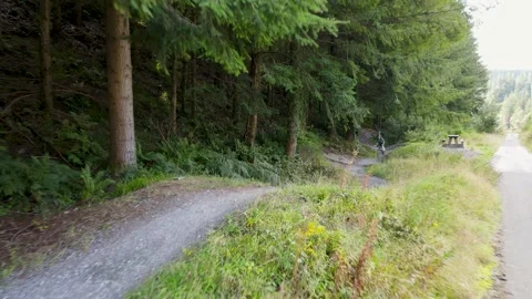 Drone Tracking Shot of Mountain Biker Going Downhill 2 動画素材 221266294