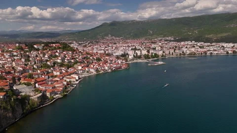 Drone Tracking Shot of Ohrid Old Town Coast and Speedboat on Lake, 4K Stock Footage 337177695