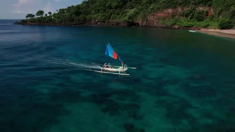 Drone Tracking Shot of Outrigger Sailboat Near Virgin Beach Bali Stock Footage 337802273