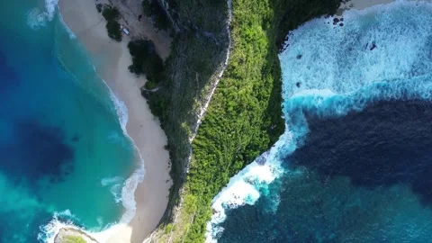 Drone Tracking Shot Over Kelingking Beach Cliff Ridge to Ocean Stock Footage 344880305