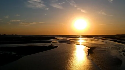 Drone tracking shot over river delta at sunset Stock Footage 115094818