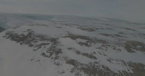 Drone Tracking Shot Over Snowy Hills, 4K Stock Footage 314403556