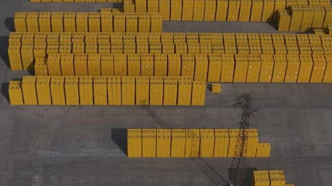 Drone Tracking Shot Over Yellow Construction Blocks Yard for Export and Stock Footage 336663994