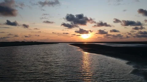 Drone tracking shot of river delta at sunset 5 Stock Footage 122702505