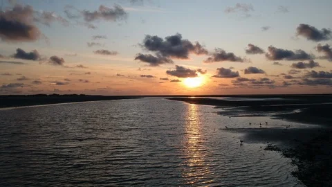 Drone tracking shot of river delta at sunset 4 Stock Footage 122702507