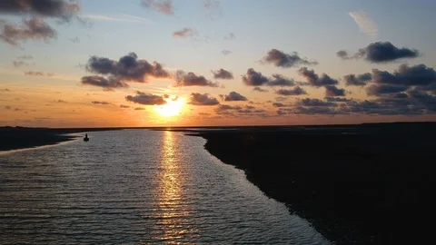 Drone tracking shot of river delta at sunset 1 Stock Footage 122702754