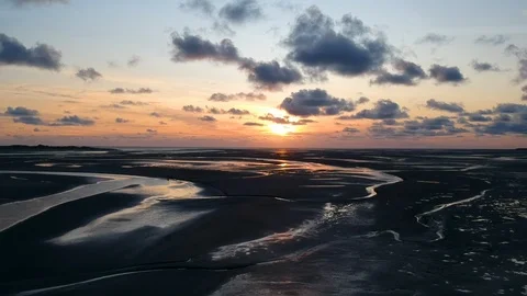 Drone tracking shot of river delta at sunset 6 Stock Footage