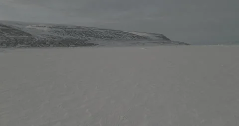Drone Tracking Shot Toward Snowy Hills, 4K Stock Footage 314403770