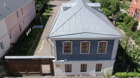 Drone tracking sideways near two story residential building Stock-Footage 333414825