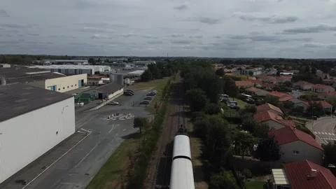 Drone tracking steam train departure in France Video stock 331710477